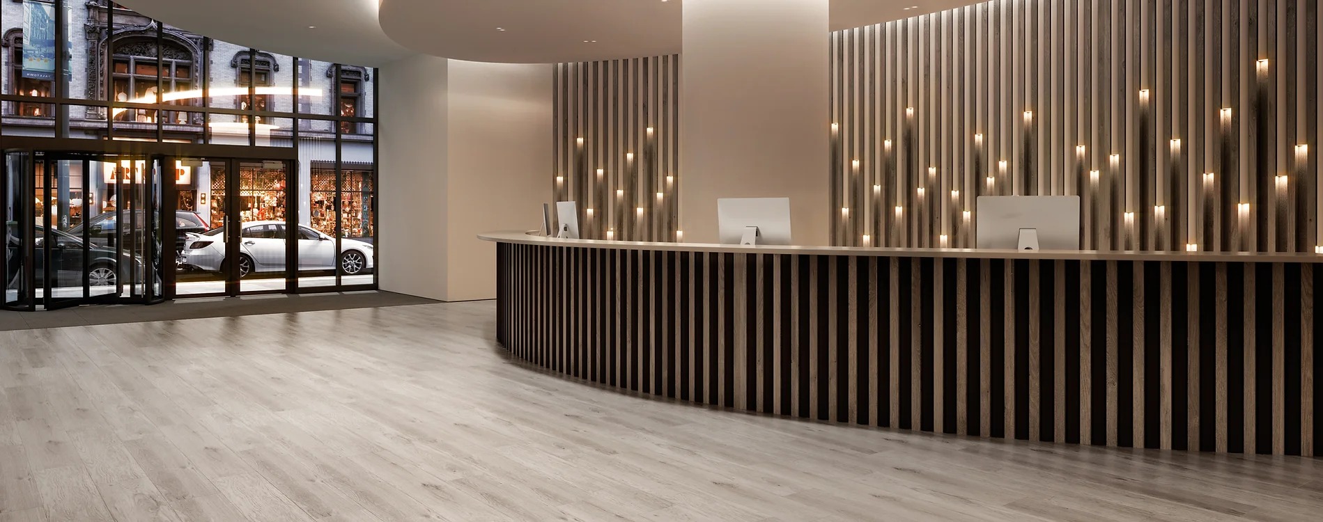 A reception desk with lights on the wall.